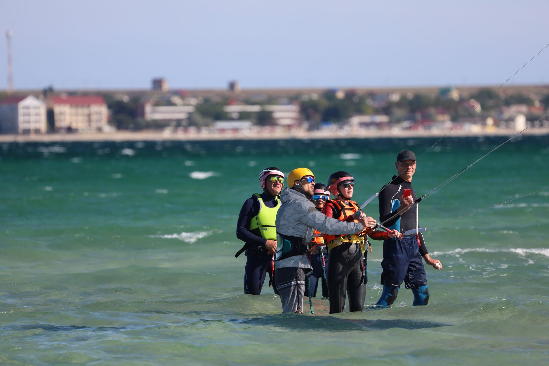 Kitesurfer learning on the beach with instructor